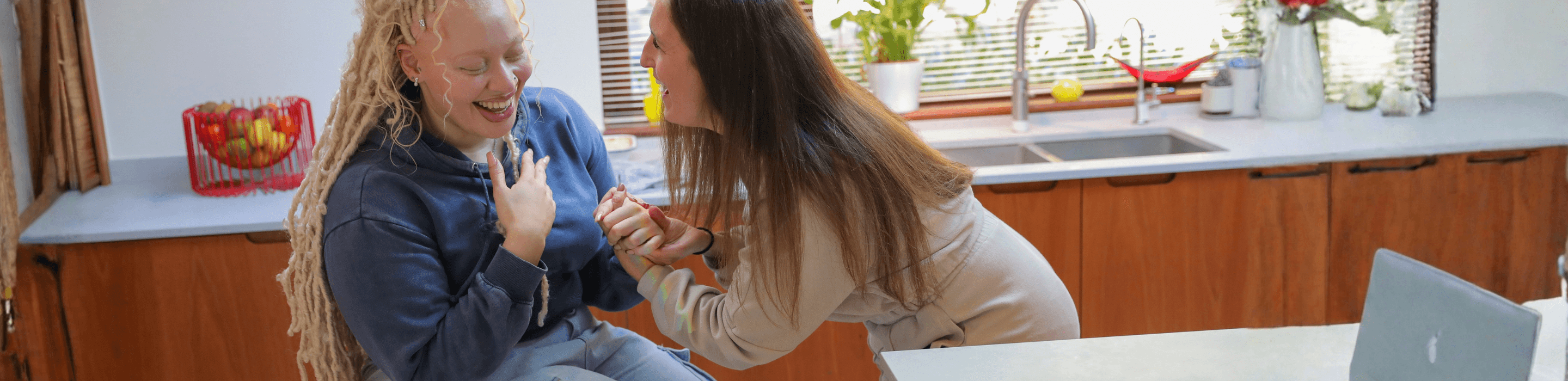 Support worker and young woman with mental health needs sharing a positive moment together at home in Nottingham. Consistent, non-judgmental support that helps make each day feel more manageable.